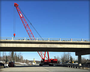 click to view larger image of crane with Glenn Highway Overpass Click for larger photo of crane with Glenn Highway Overpass