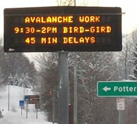 Sign warning of delays due to avalanche